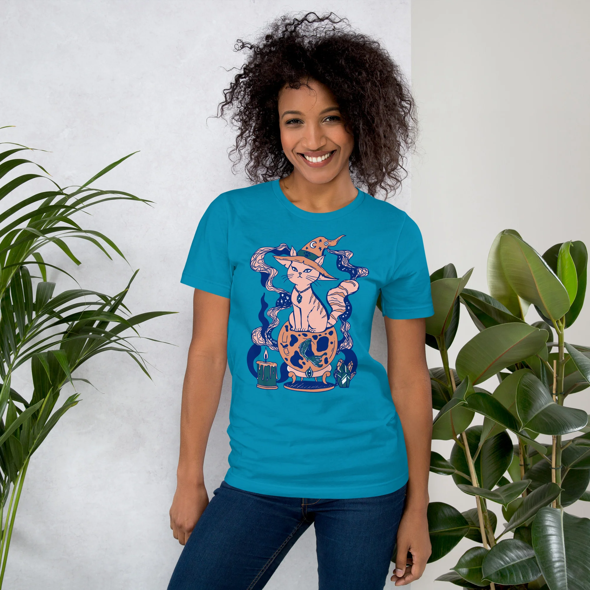 Woman wearing aqua pink cat t-shirt with magical fortune design and mystical elements