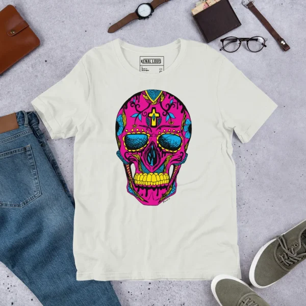 Cream pink skull t-shirt with vibrant Day of the Dead design featuring bold magenta, blue, and yellow colors