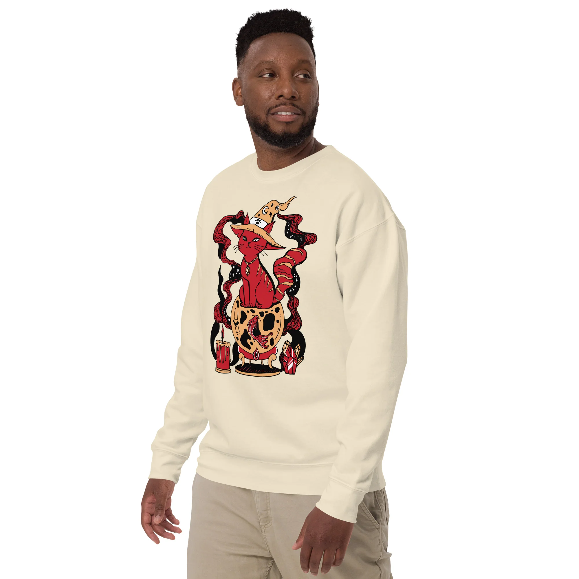 Man wearing bone-colored red cat art sweatshirt with magical fortune design featuring red cat and decorative elements