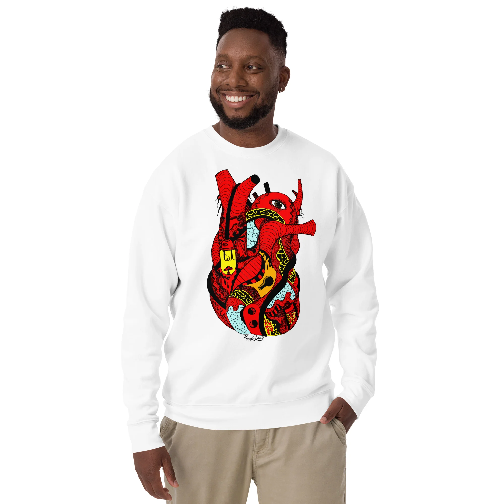 Man wearing a white red heart sweatshirt with colorful graphic art design and ribbed crew neckline.