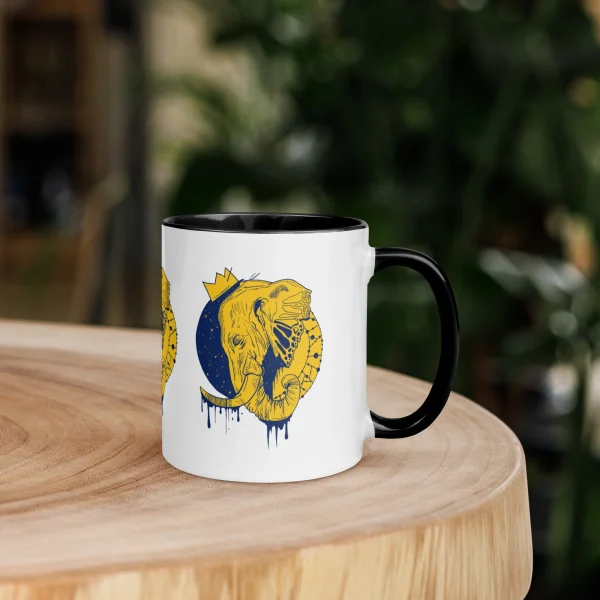 Ceramic elephant mug with a crowned elephant illustration, colorful rim, handle, and interior — royal elephant art cup