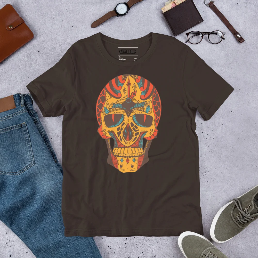 Brown skull t-shirt with gold and red ornate skull art design, flat lay with accessories