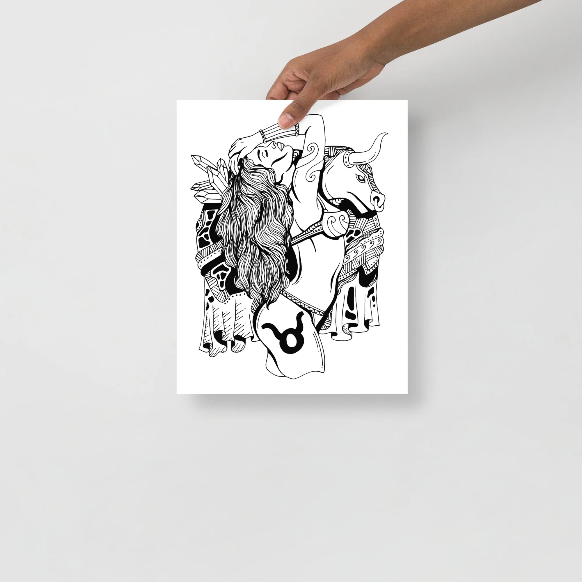 Taurus zodiac art print featuring a woman with long hair on a decorated bull in elegant line art style