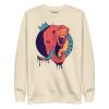Elephant sweatshirt with a crowned elephant crown illustration by Kenal Louis, shown in bone and dusty rose crew neck styles