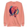 Elephant sweatshirt with a crowned elephant crown illustration by Kenal Louis, shown in bone and dusty rose crew neck styles