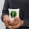 Colorful ceramic elephant mug featuring a royal crown illustration drawing by Kenal Louis, with tinted rim, handle, and interior