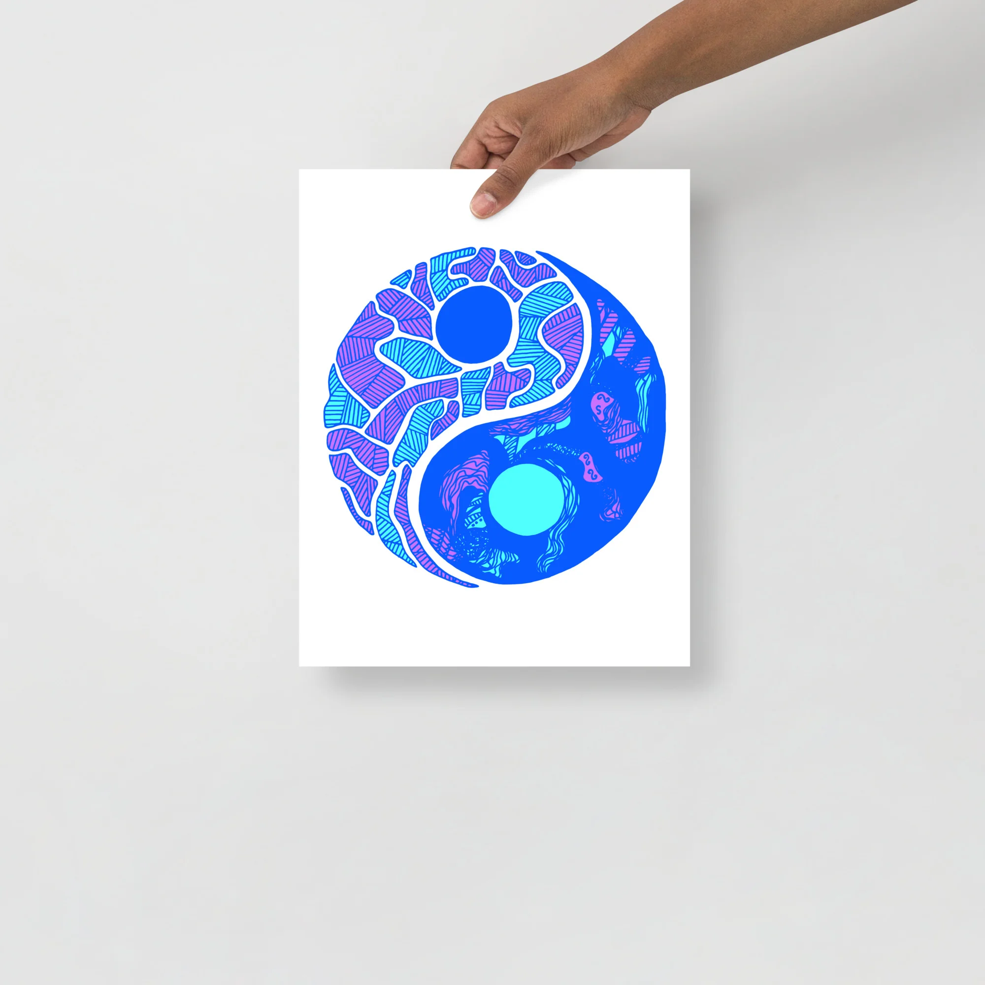 Abstract blue yin yang art print with purple and cyan patterned details held up against white background